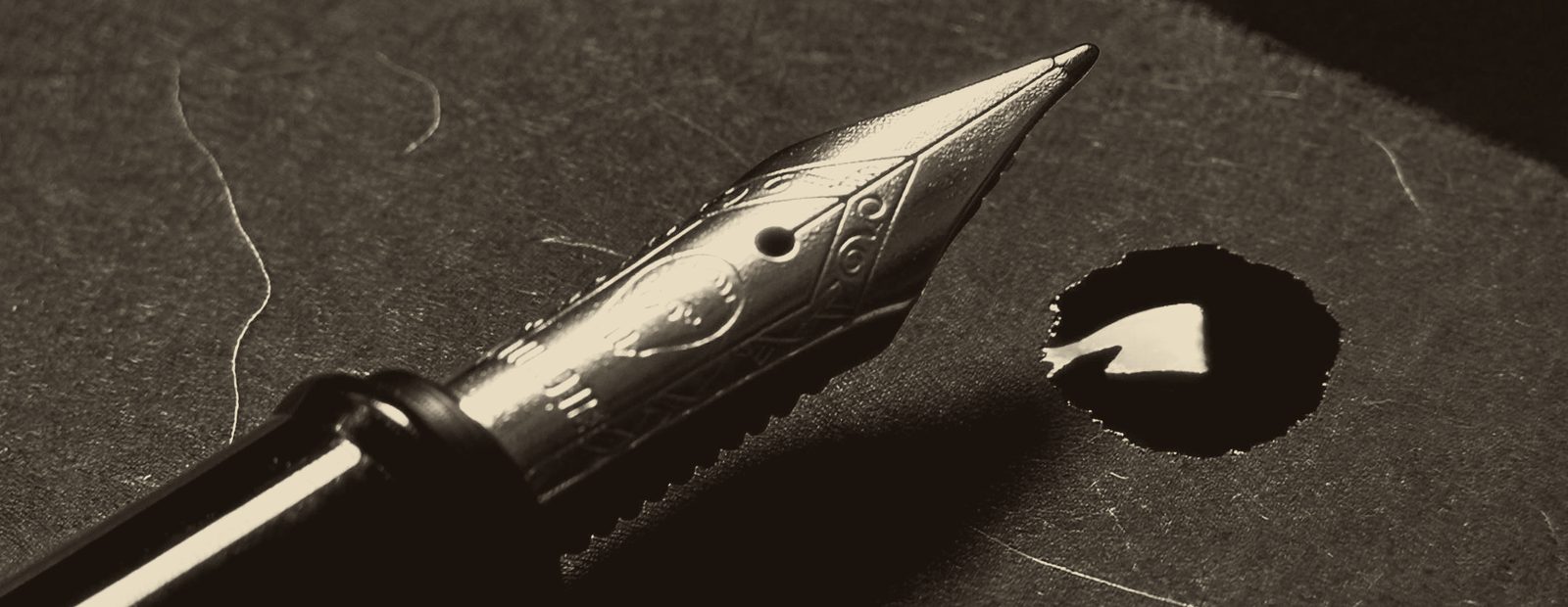 A fountain pen nib, divider art from the September Intensive booklet